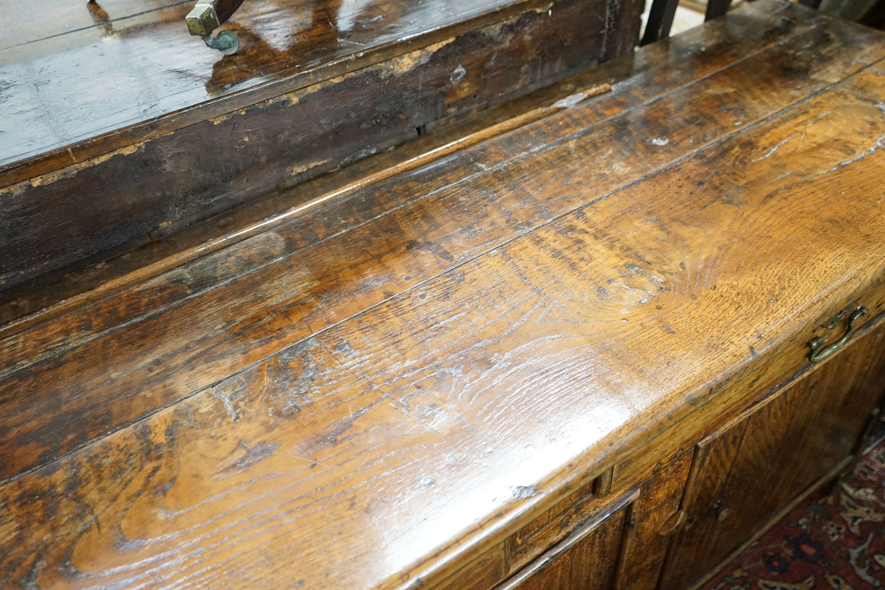 An 18th century and later oak low dresser, length 182cm, depth 52cm, height 75cm